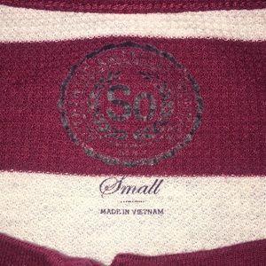 Red and white striped long sleeve shirt.